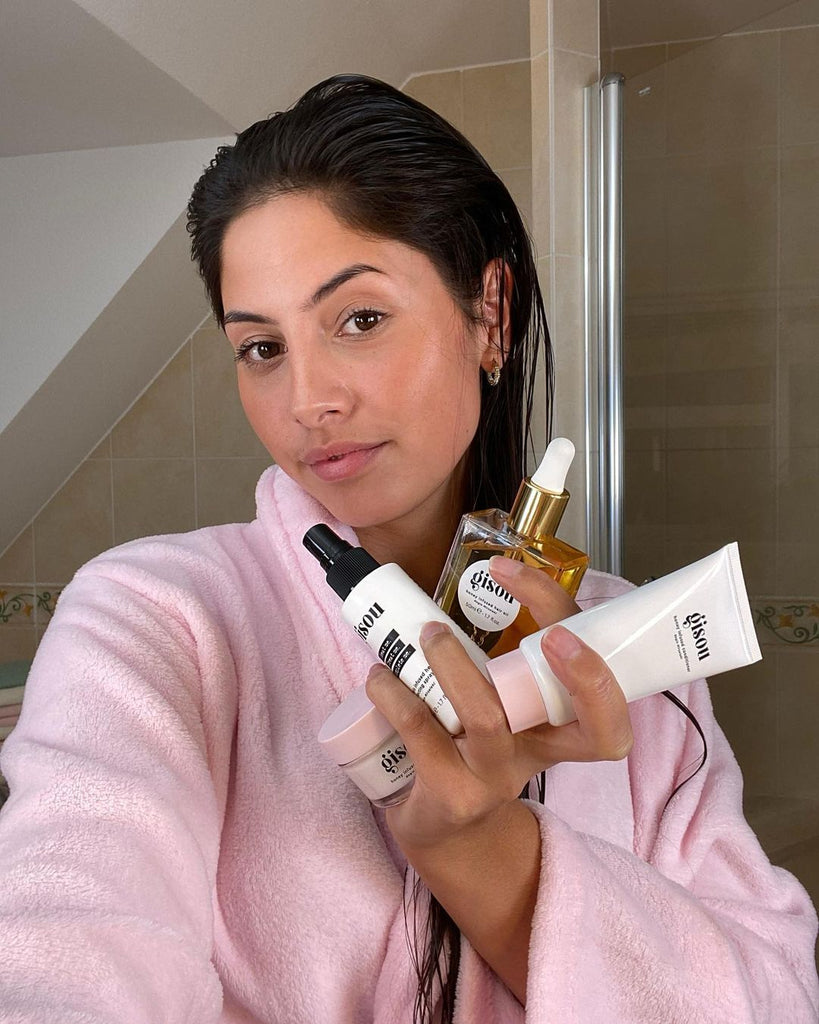 Woman holding Gisou products